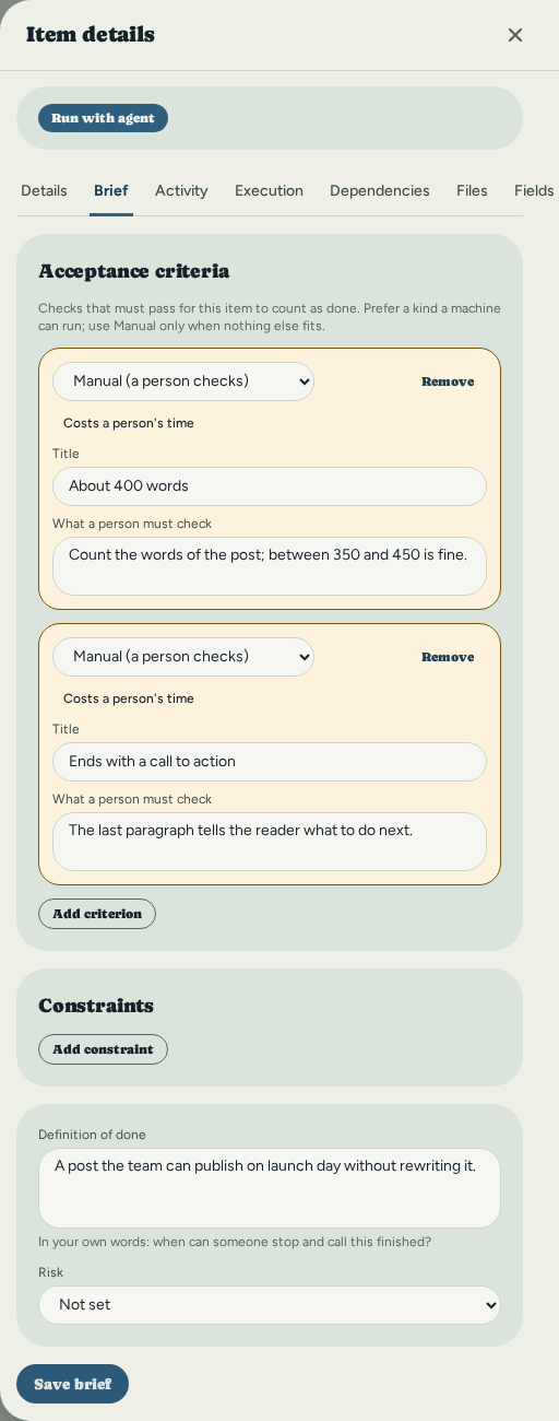 The Brief tab of 'Draft the launch announcement': two Manual criteria, 'About 400 words' and 'Ends with a call to action', each with what a person must check and marked 'Costs a person's time', no constraints, a definition of done, Risk not set, and a Save brief button.
